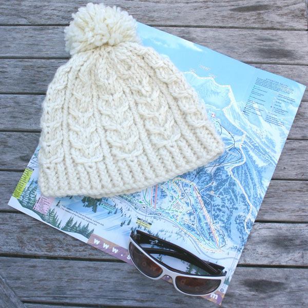 Snowbird Hat, a chunky knit cabled knitting pattern design by Mary Ann Stephens